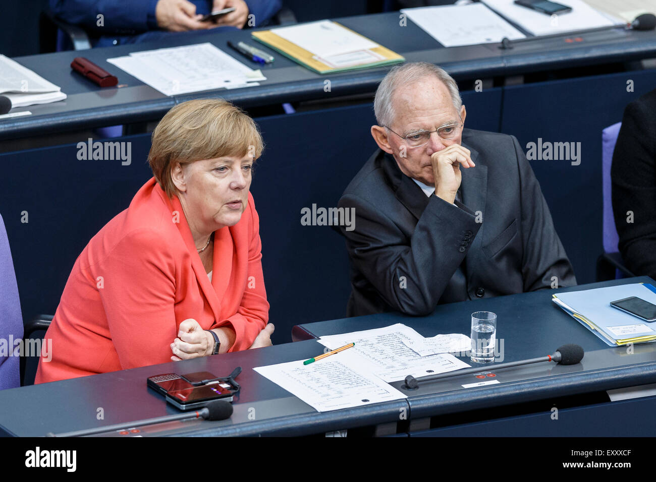 Berlin, Germany. 17th July, 2015. Special session of the German Parliament - consultation of government on the ' negotiations of the Government Federal relative to the concession of financial support for the Hellenic Republic of Greece ' realized at the German Parliament on 17.07.2015 in Berlin, Germany./Picture: German Chancellor Angela Merkel talks with Wolfgang Schäuble (CDU), German Minister of Finance, during the session of the german Parliament relative to the concession of financial support for the Hellenic Republic of Greece. Credit:  Reynaldo Chaib Paganelli/Alamy Live News Stock Photo