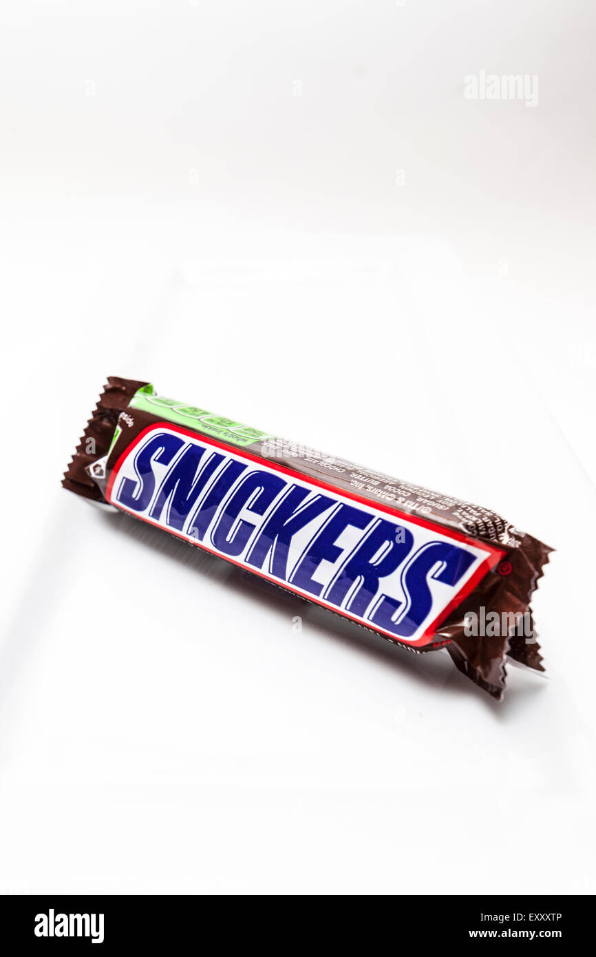 A Snickers Candy bar on a white background Stock Photo