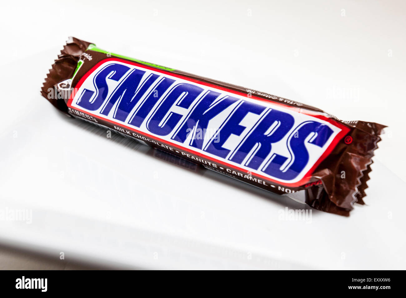 A Snickers Candy bar on a white background Stock Photo