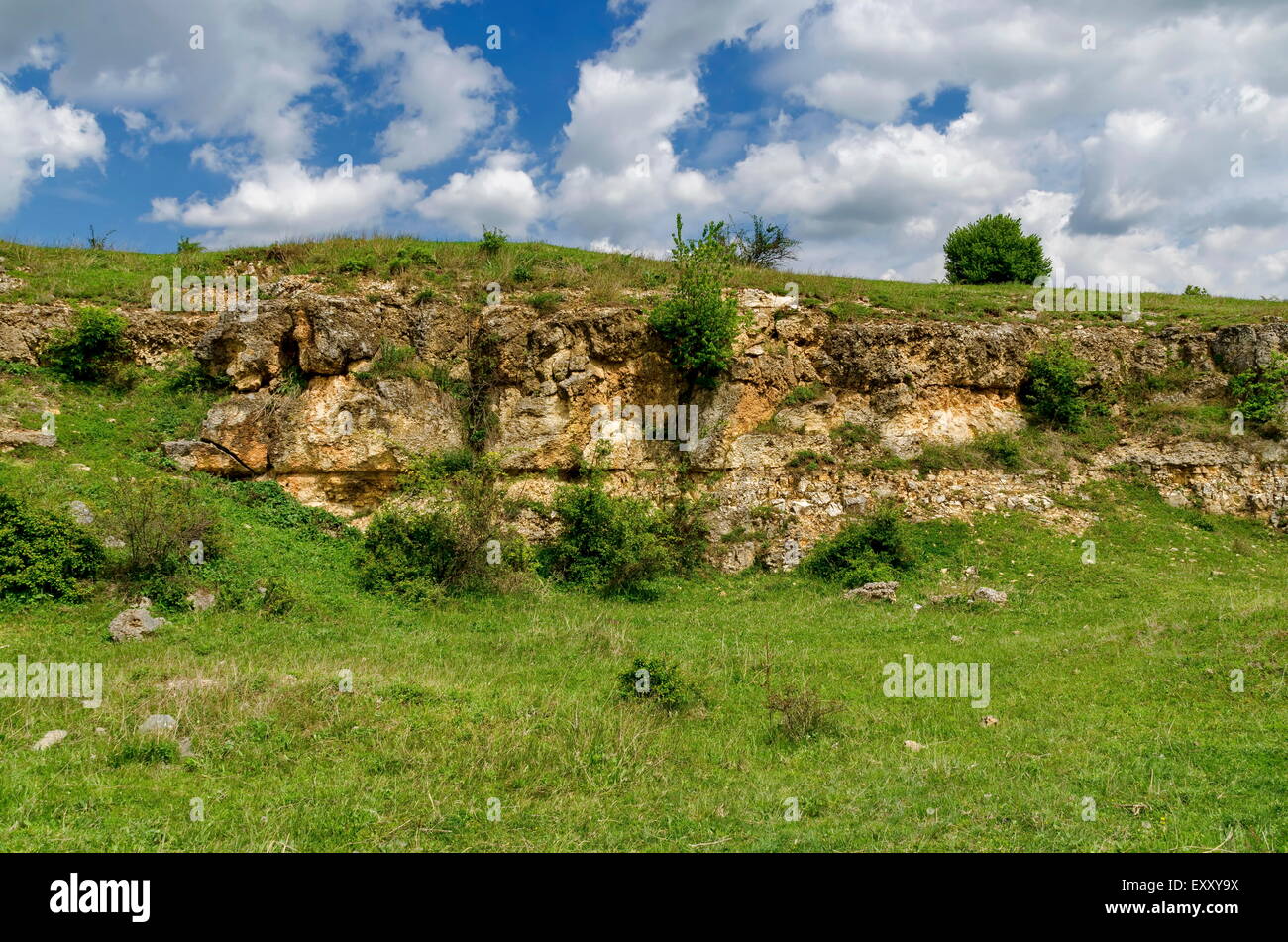 General view toward sedimentary rock in the field, Ludogorie, Bulgaria Stock Photo