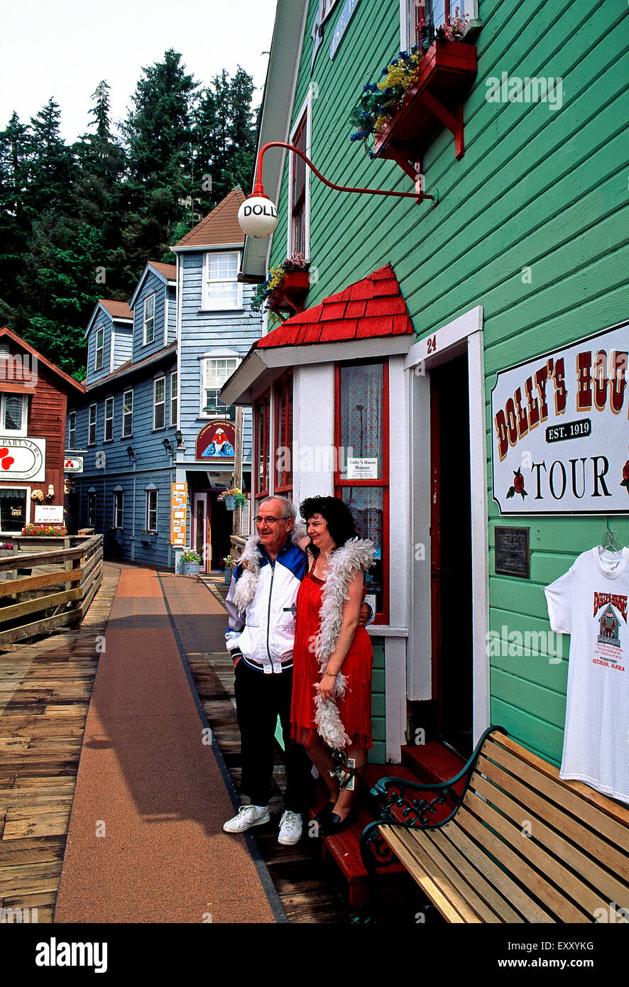 "Dolly" posing for photo with tourist.Dolly';s House on Creek Street,Ketchikan,Alaska Stock