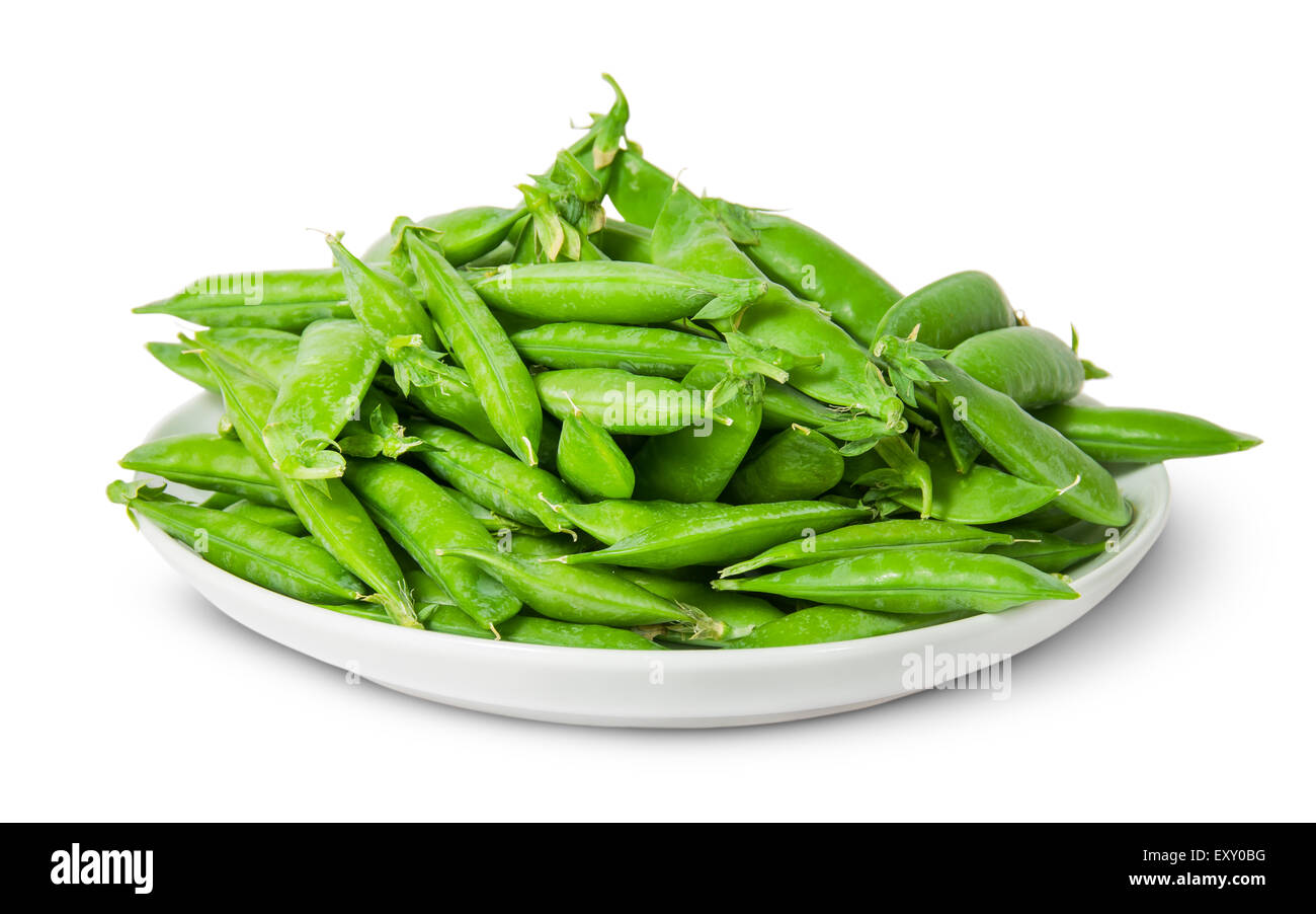 Big pile of green peas in pods on white plate isolated on white background Stock Photo