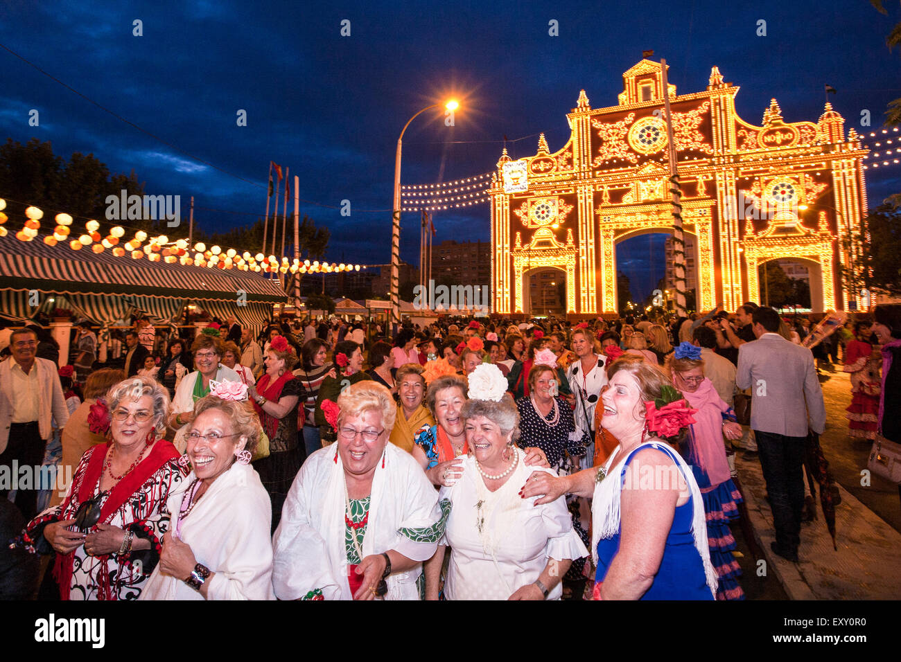 Dancing to drum beat and in traditional Seville dress in