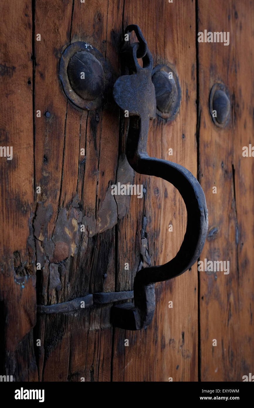 Rusted gate handles of the Shaki Caravanserai built in 18th century and used by merchants to store their goods in cellars, who traded on the first floor, and lived on the second in the town of Shaki, Azerbaijan Stock Photo