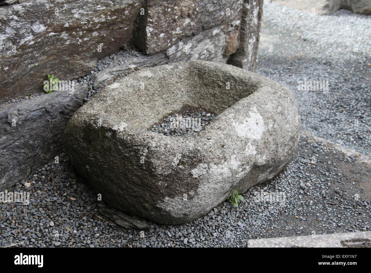 Simple stone font in the Cathedral ruin at Glendalough Monastic Site in Ireland Stock Photo