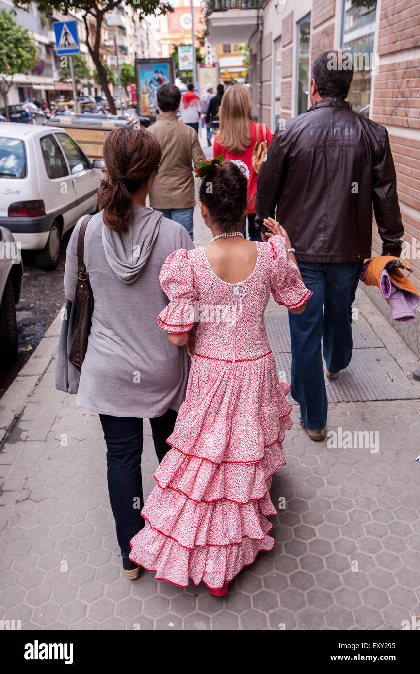 Young girl in traditional Seville dress in Seville, centre of Seville
