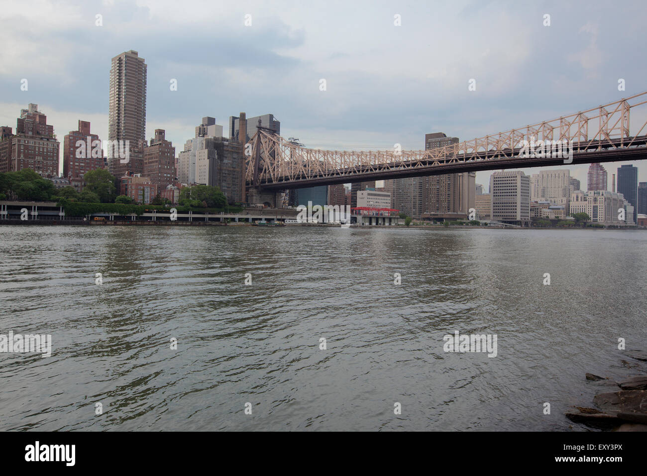 NEW YORK - May 28, 2015: The view of midtown Manhattan buildings on the Hudson River, from Roosevelt Island.The Queensboro bridg Stock Photo