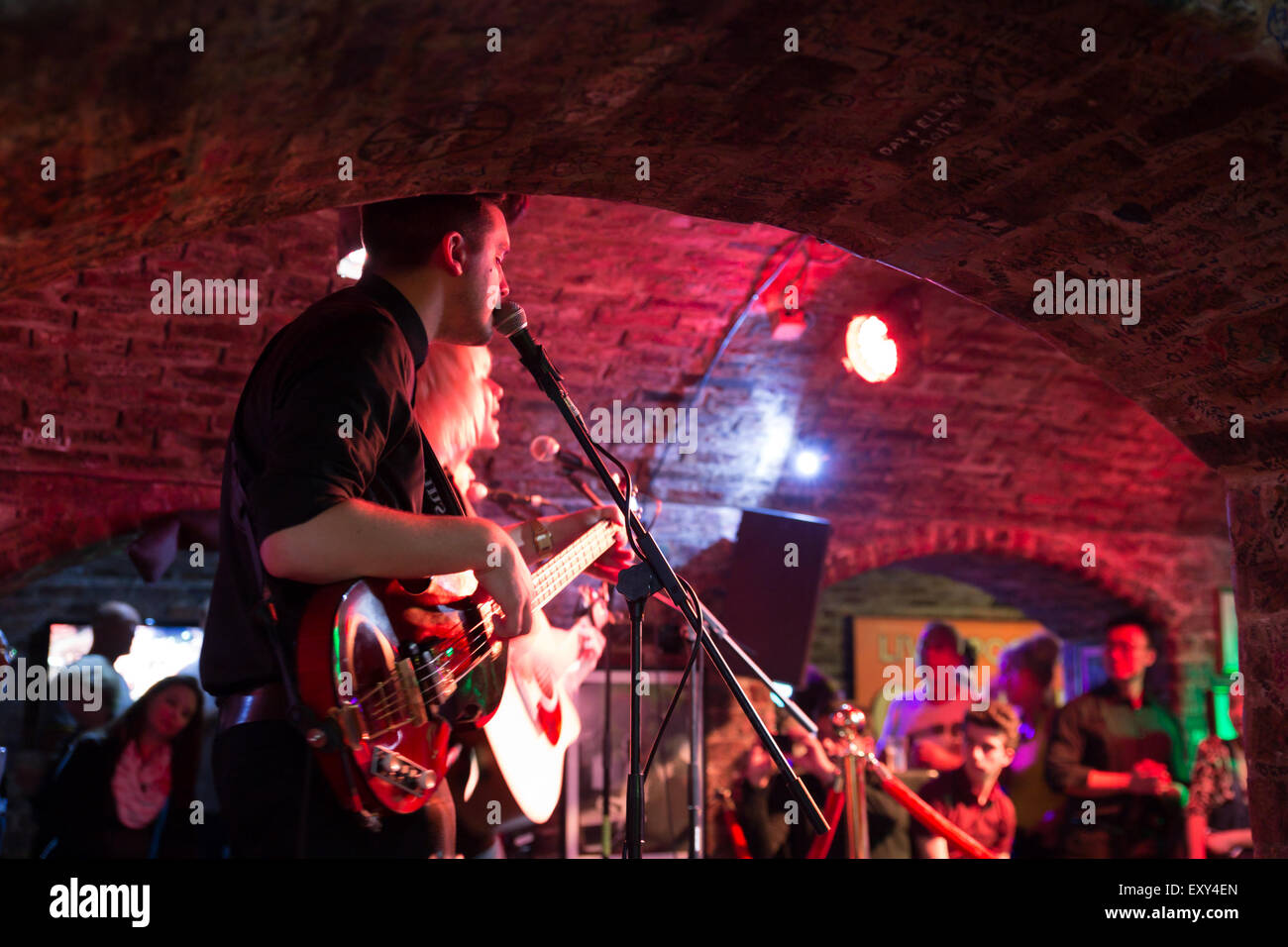 Liverpool, United Kingdom - October 11, 2014: Band performs to audience inside the historic Cavern Club in Liverpool.  This famo Stock Photo