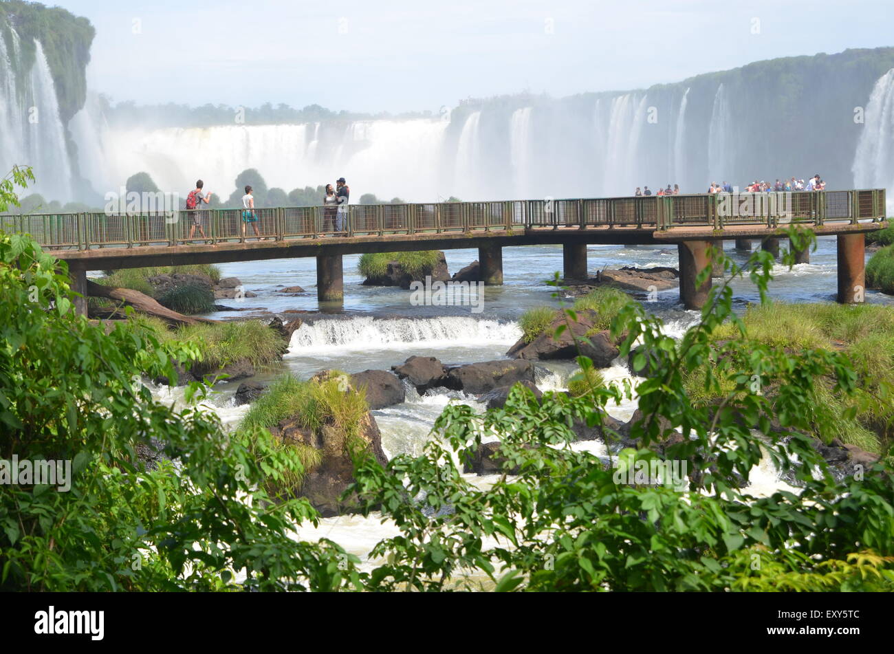 A walkway over water at Iguazu falls Stock Photo