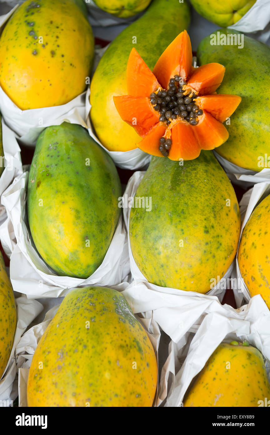 Fresh cut juicy tropical papaya mamao fruit with seeds at Brazilian