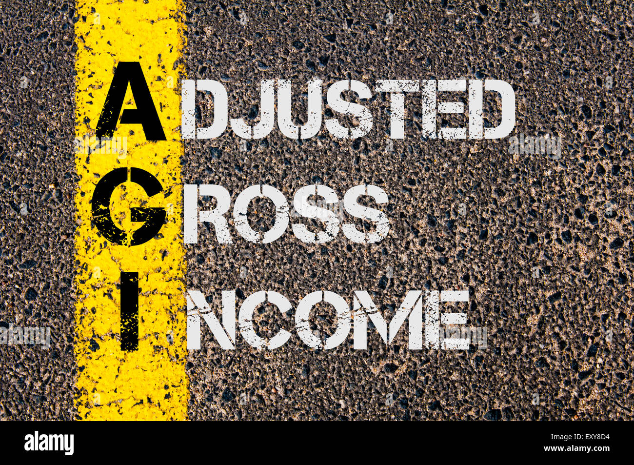 Concept image of Business Acronym AGI as Adjusted Gross Income  written over road marking yellow paint line. Stock Photo