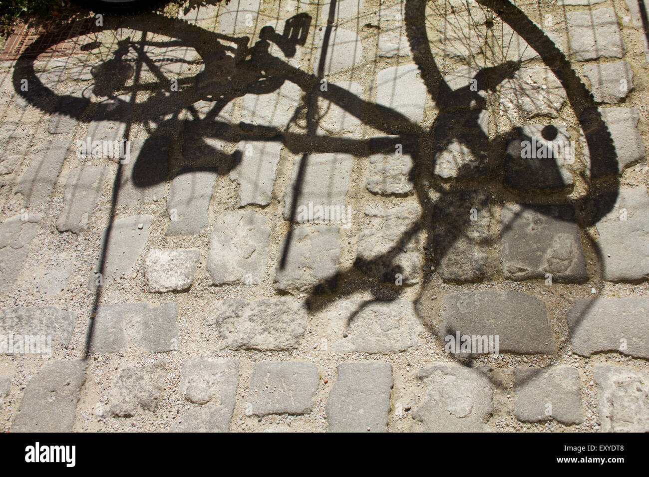 Shadow of a bike on the asphalt. Myrina Lemnos or Limnos island, Greece. Stock Photo