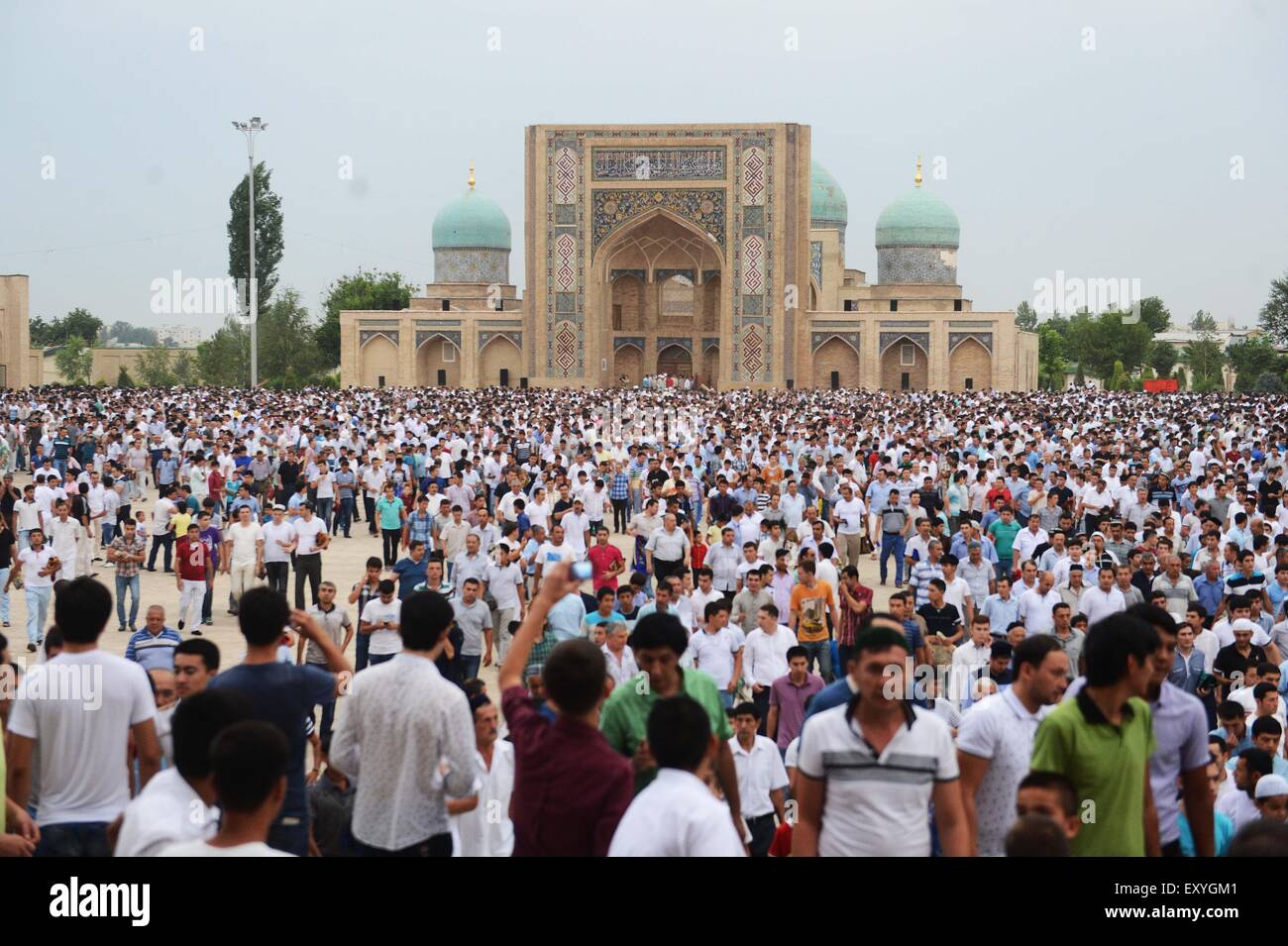 Tashkent, Uzbekistan. 18th July, 2015. Muslims gather after offering