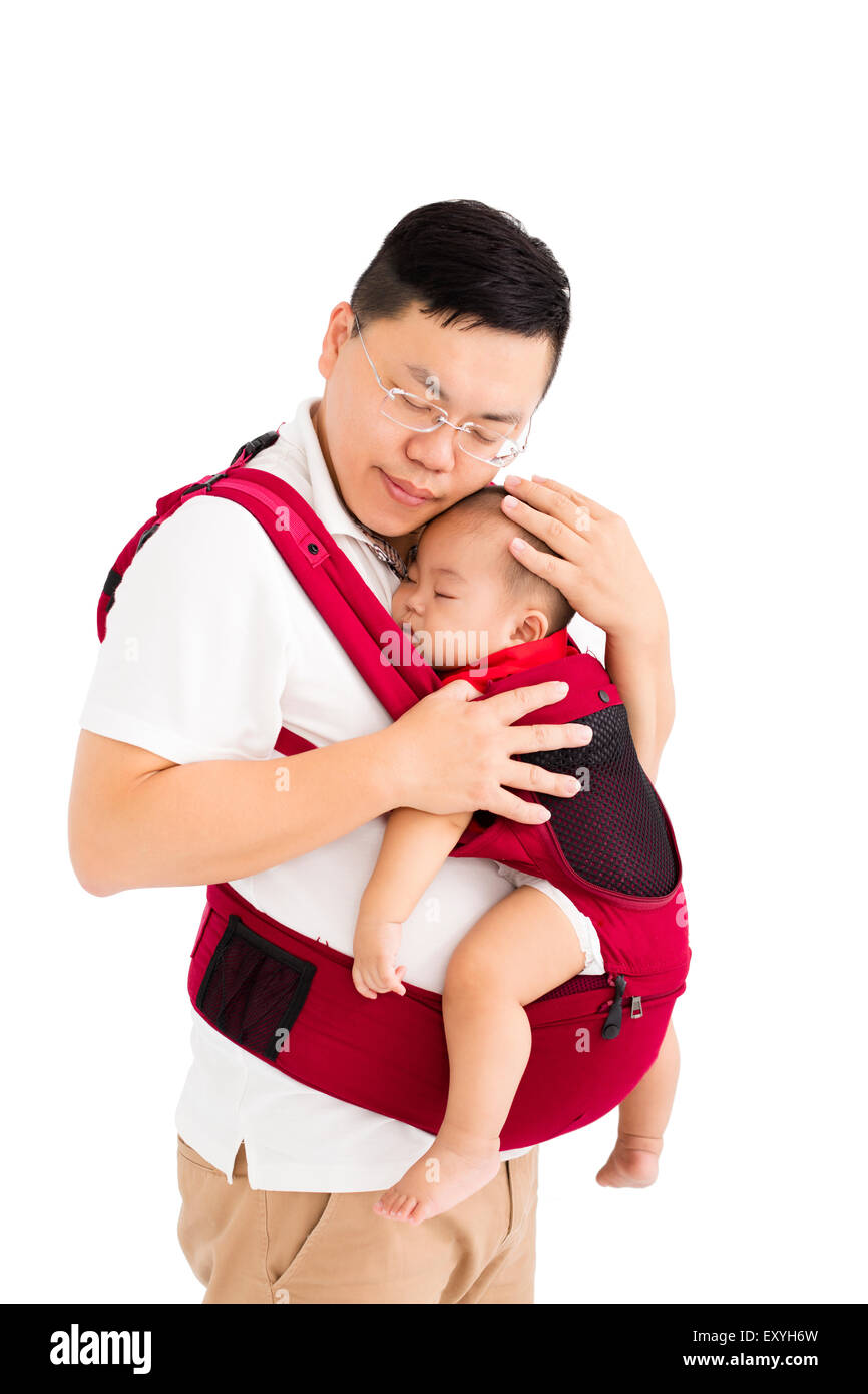 father  holding a baby in a baby carrier Stock Photo