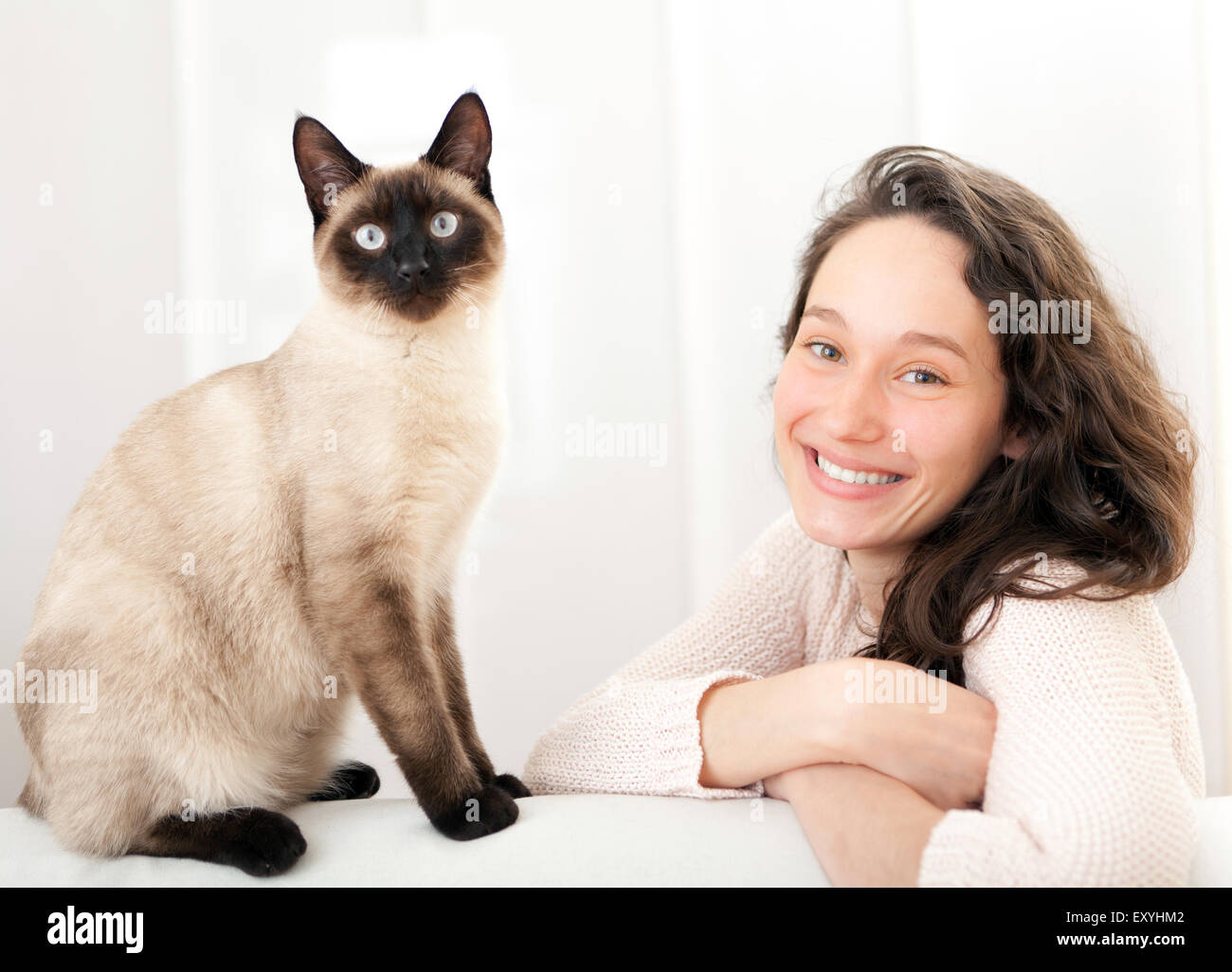 View of a woman  having good times at home with cat Stock Photo