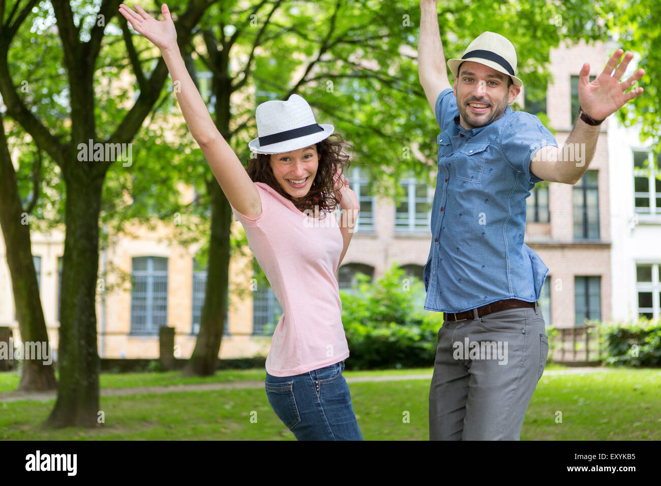 View of a Young happy couple having fun at the park Stock Photo - Alamy