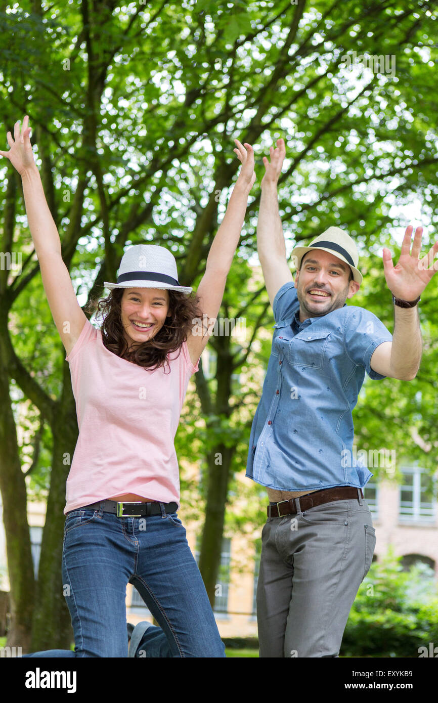 View of a Young happy couple having fun at the park Stock Photo - Alamy