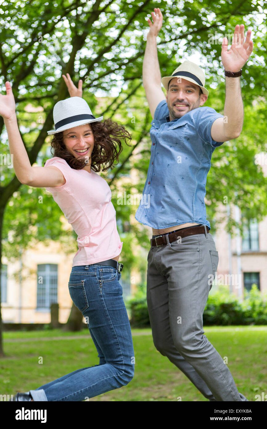 View of a Young happy couple having fun at the park Stock Photo - Alamy