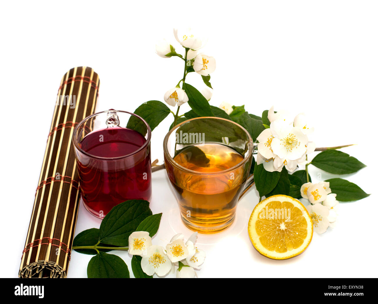 two glasses of drink and lemon on a white background Stock Photo - Alamy