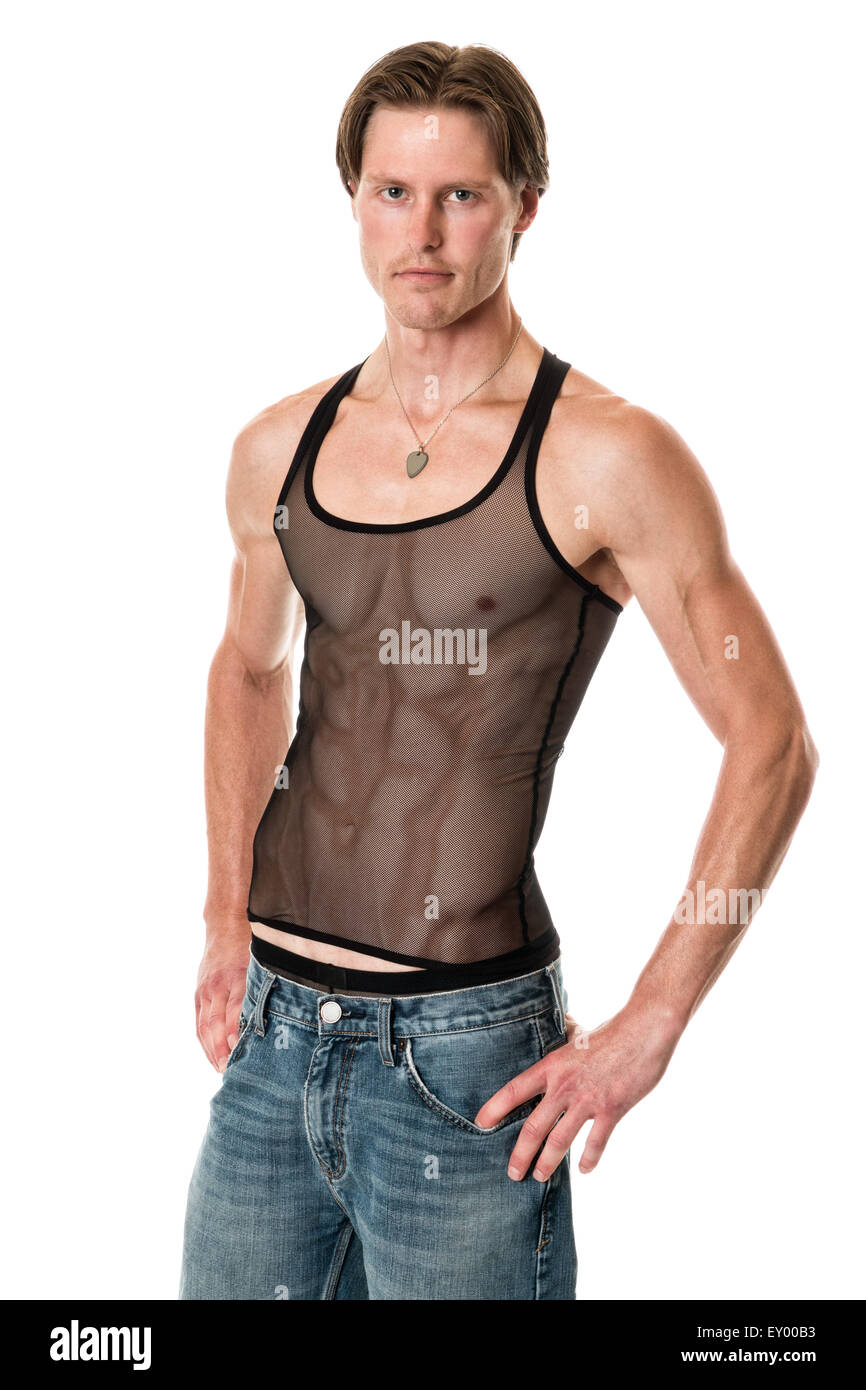 Man in mesh tank top and jeans. Studio shot over white. Stock Photo