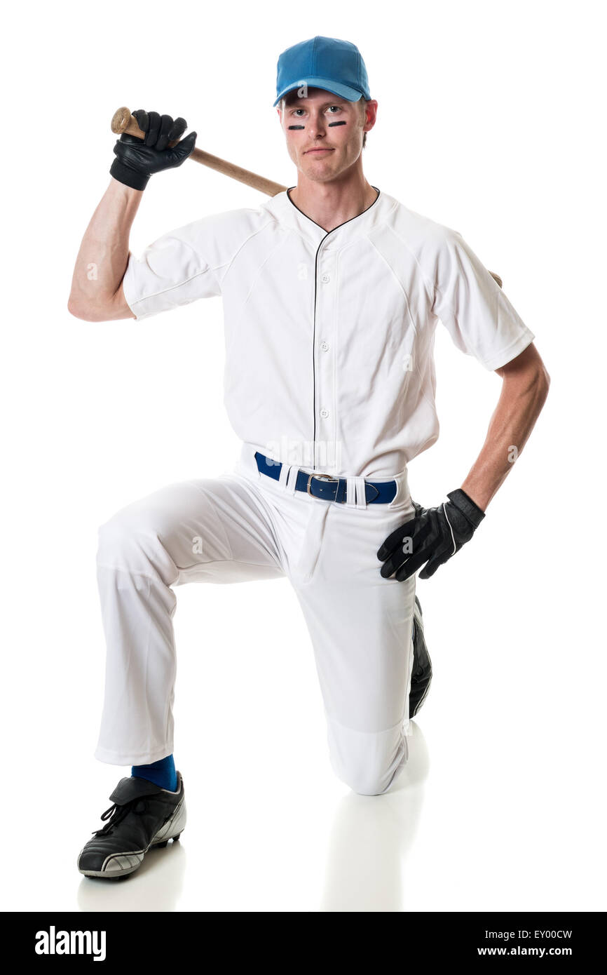 Young adult baseball player. Studio shot over white. Stock Photo