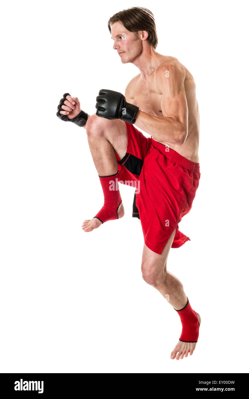 Young adult martial artist. Studio shot over white. Stock Photo