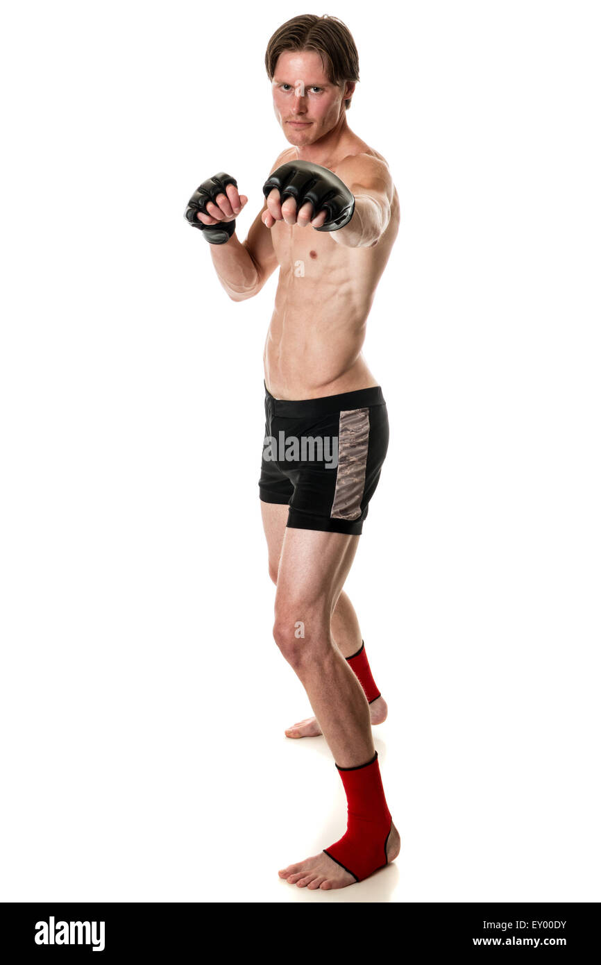 Young adult martial artist. Studio shot over white. Stock Photo