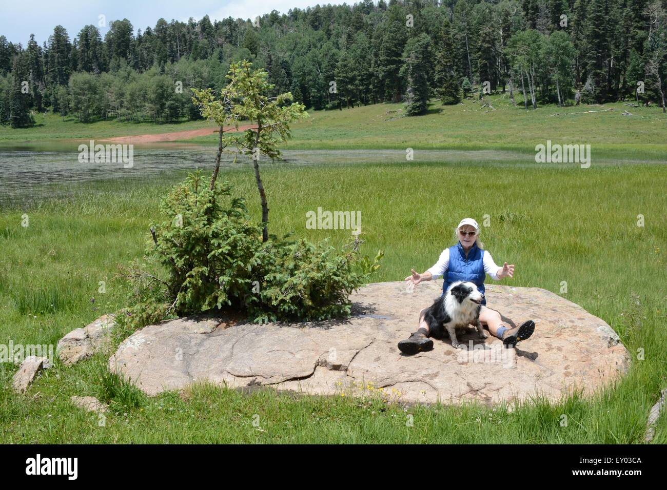 My sister and her dog on giant boulder gregorio lake new mexico usa