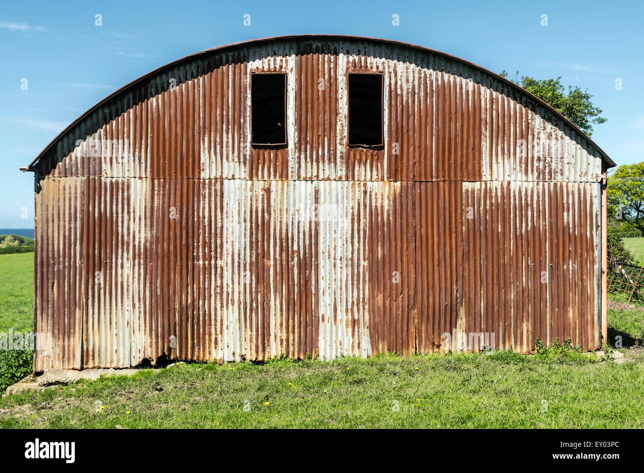A rusting Tin corrugated hay barn in the countryside Stock Photo Alamy