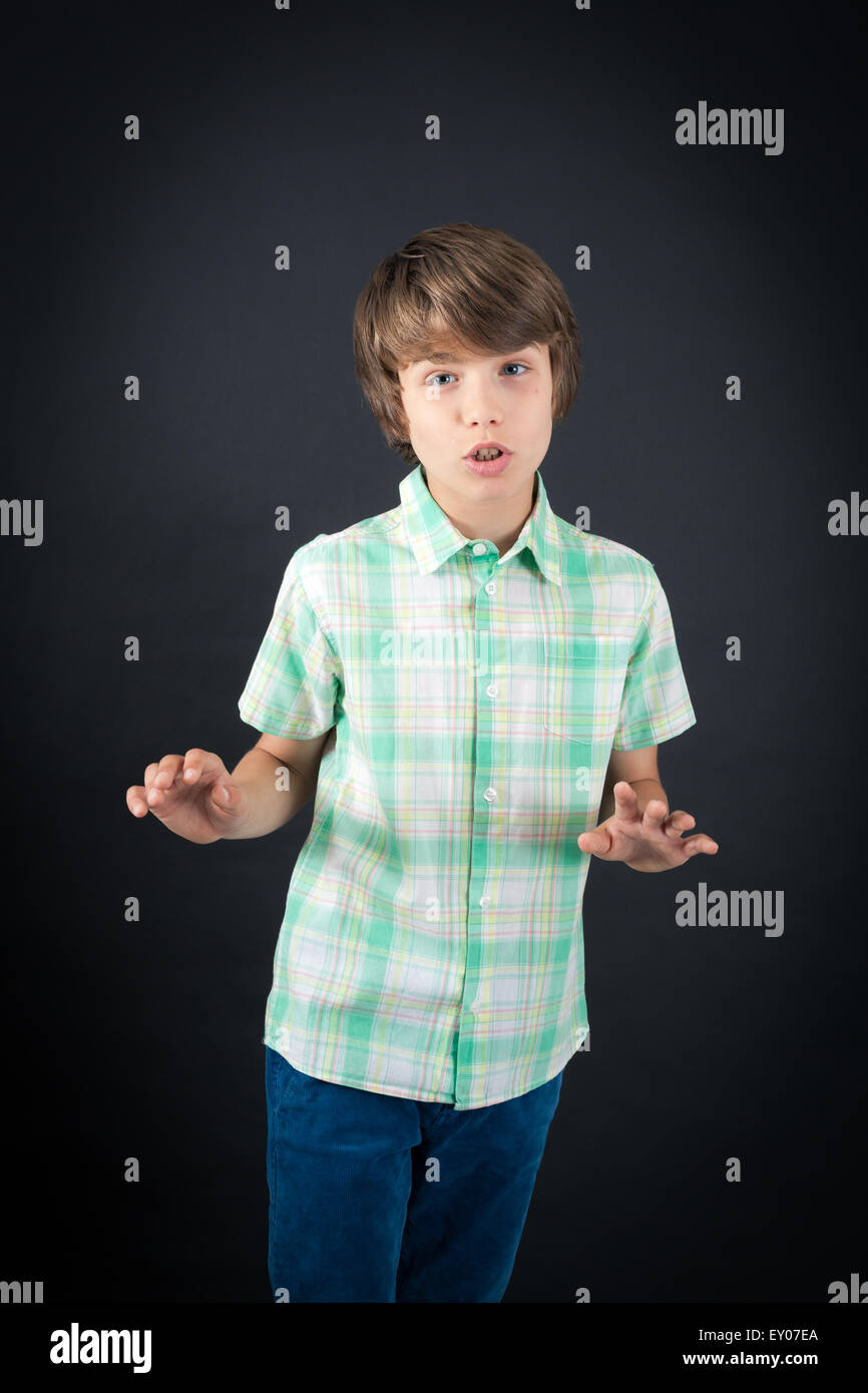 Handsome boy doing different expressions in different sets of clothes: innocent Stock Photo