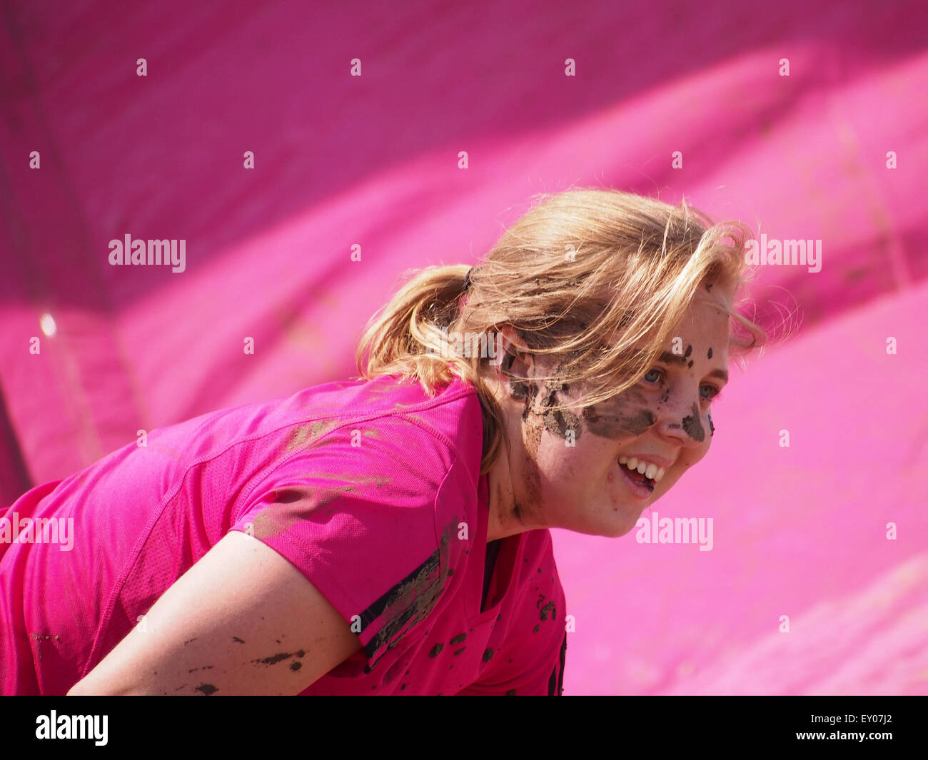 Portsmouth, UK. 18th July, 2015. A participant in the Race For Life - Pretty muddy has mud smeared across her face. The Race for Life Pretty Muddy event is open to females only and consists of a 5K mud covered obstacle course Credit:  simon evans/Alamy Live News Stock Photo