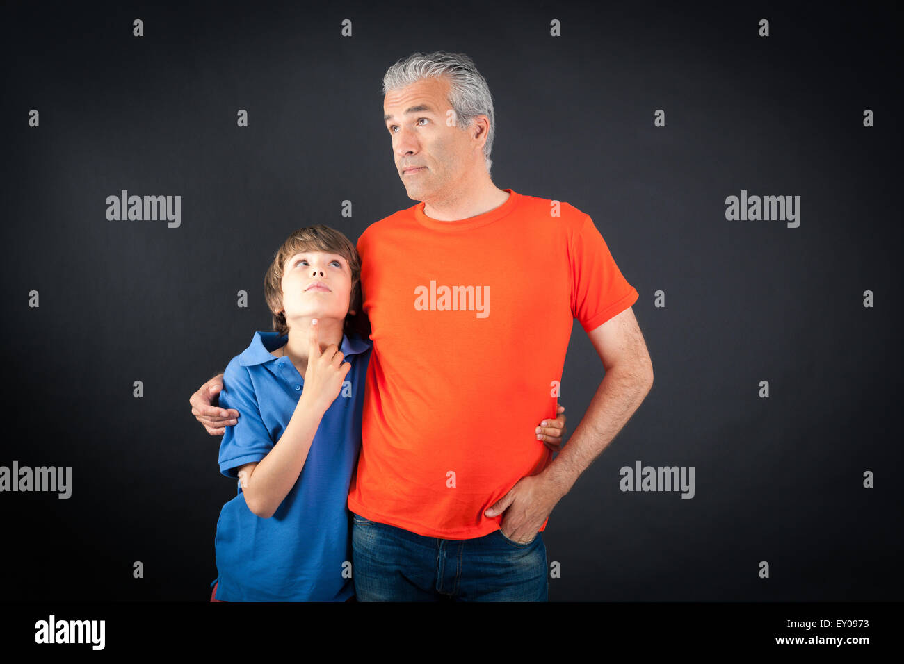 Handsome family doing different expressions in different sets of clothes: thinking Stock Photo