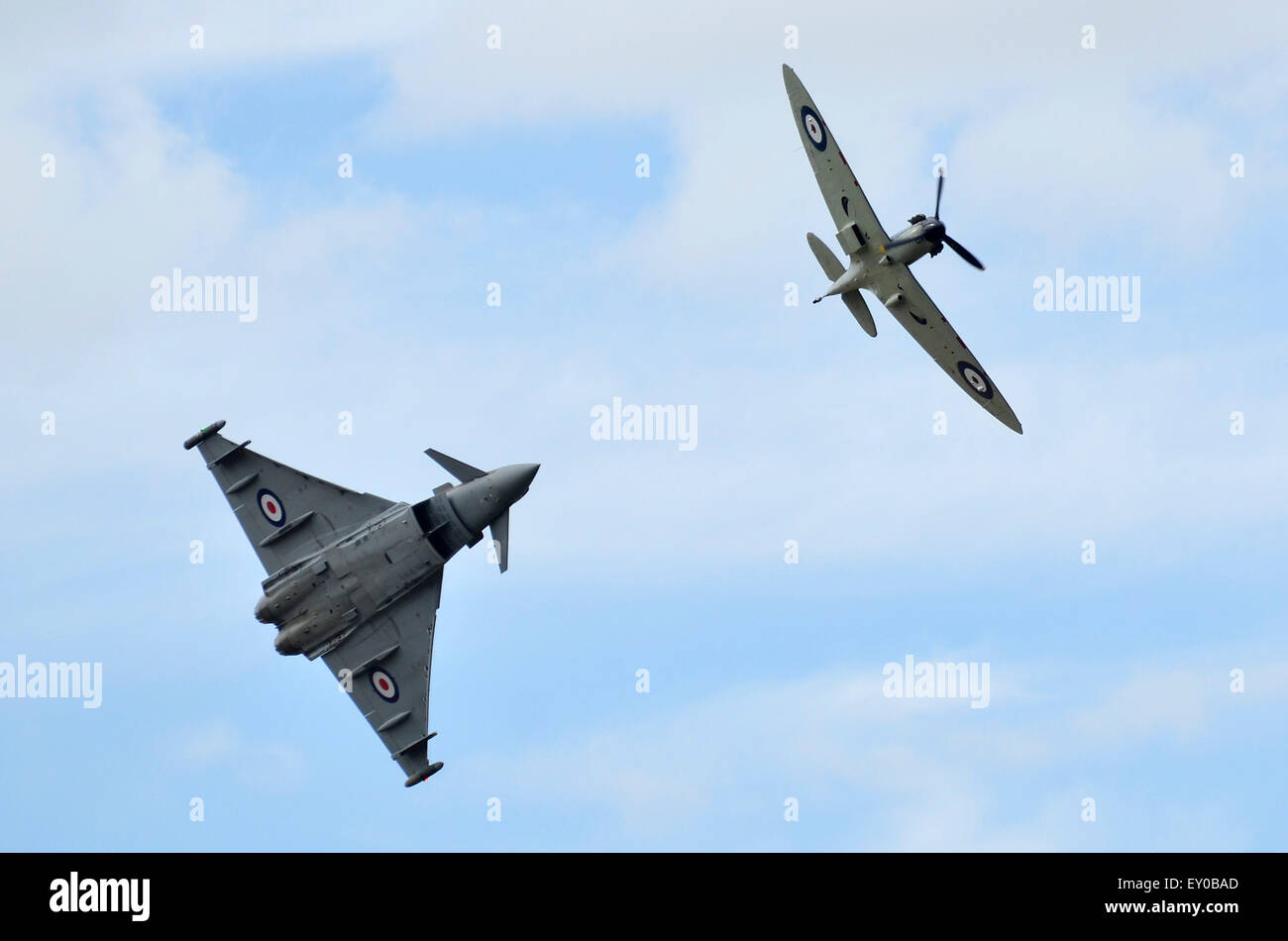 Supermarine Spitfire and Eurofighter Typhoon, both in RAF Battle of Britain colour schemes, display together at RIAT 2015, Fairford, UK. Credit:  Antony Nettle/Alamy Live News Stock Photo
