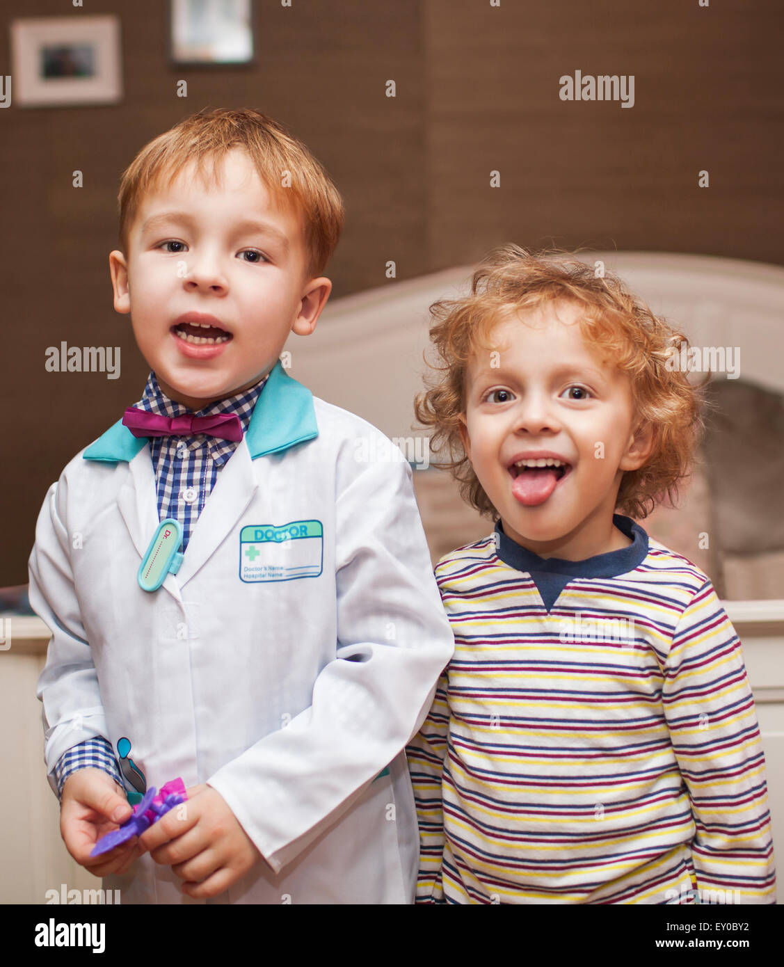 Little doctor and his patient showing tongue Stock Photo Alamy