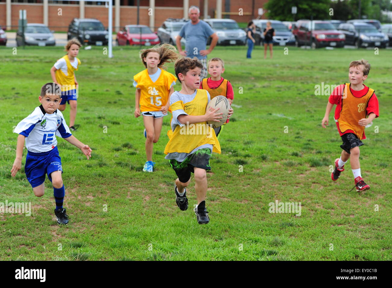 Sports youth rugby played in the USA in Virginia - children 9 10 11 12 girls boys practice together Stock Photo