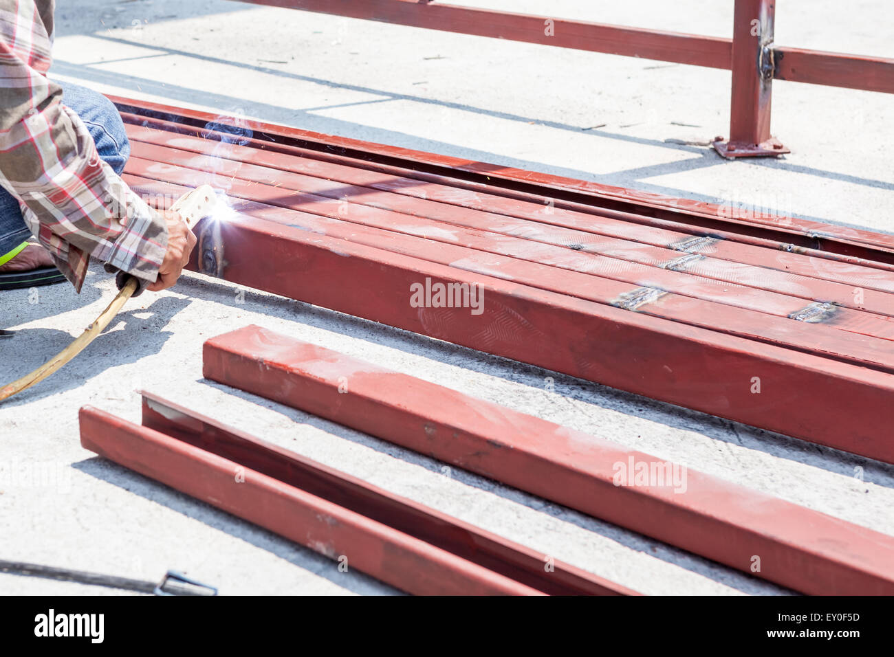 an man welding the iron bars together Stock Photo Alamy