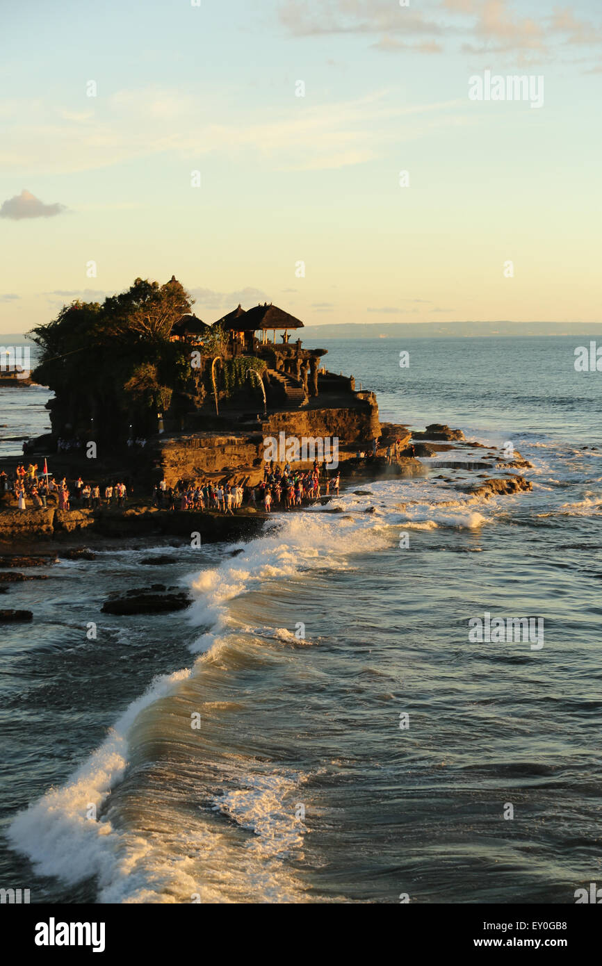 Rock formation with the Tanah Lot temple on top of it. Soft evening ...