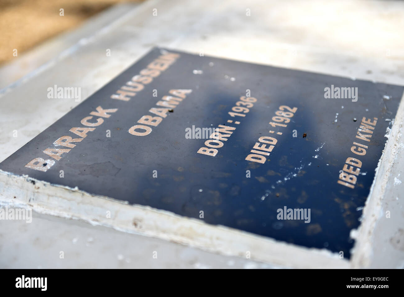 (150719) -- KOGELO, July 19, 2015(Xinhua) -- The grave plaque of Barack Hussein Obama, father of U.S. President Barack Obama, is seen at Kogelo Village in Siaya, Kenya, June 29, 2015. Barack Obama has made several trips in the village before, where his father was born and buried. (Xinhua/Sun Ruibo) Stock Photo