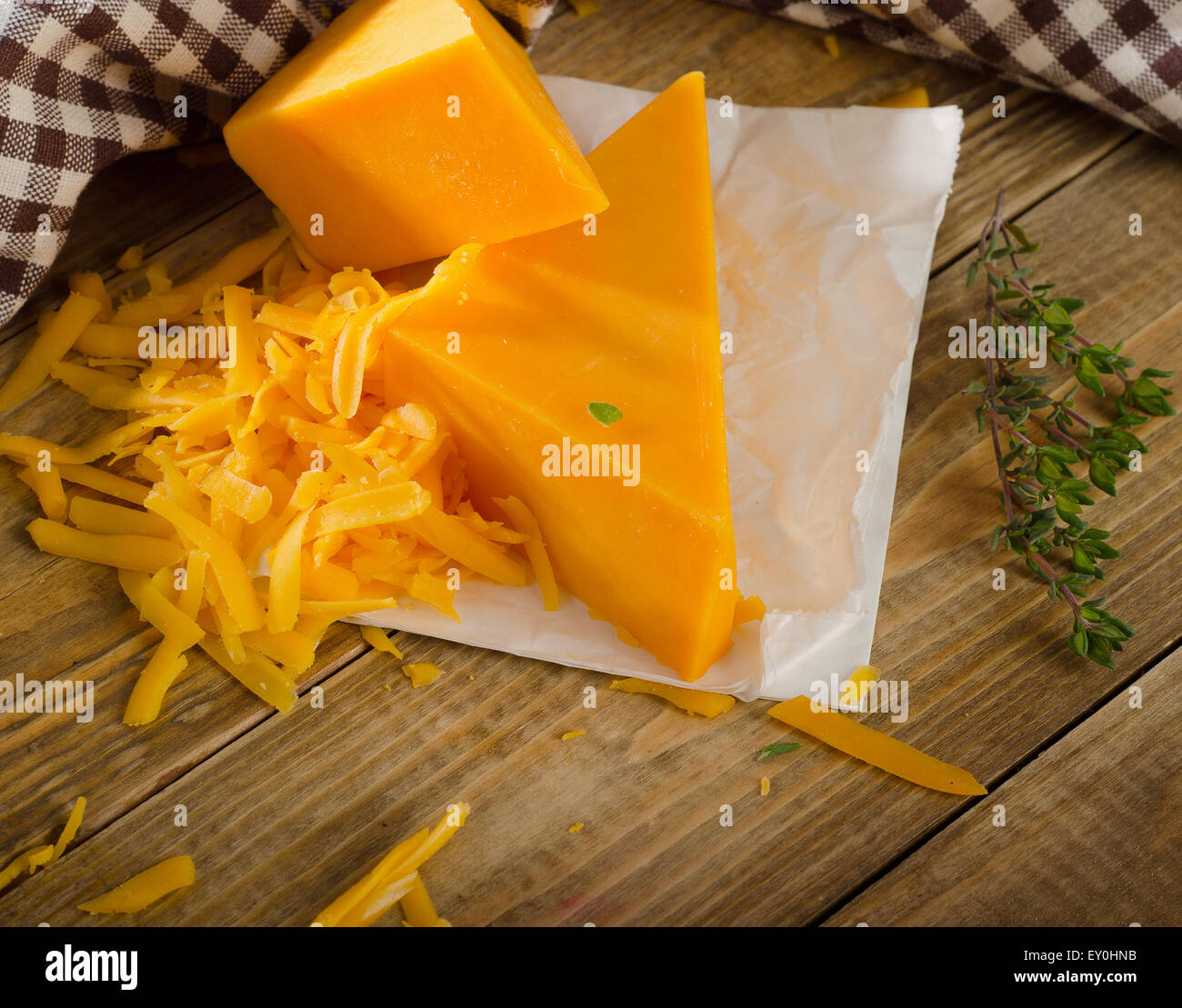 Cheddar Cheese on  rustic wooden background. Selective focus Stock Photo