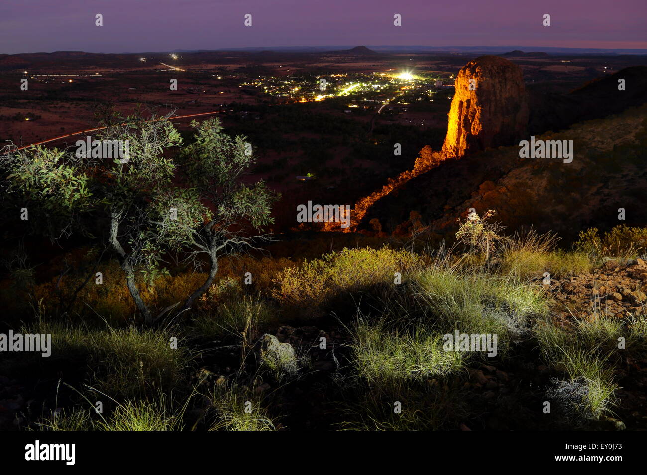 A light-painting overlooking Virgin Rock and the town of Springsure at dusk in Queensland, Australia. Stock Photo