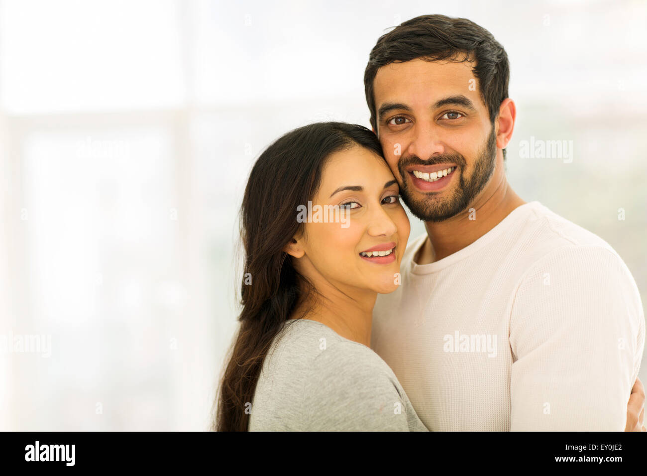 portrait of smiling Indian couple looking at the camera Stock Photo - Alamy