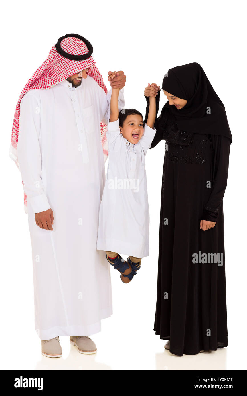 cheerful young Muslim family having fun on white background Stock Photo
