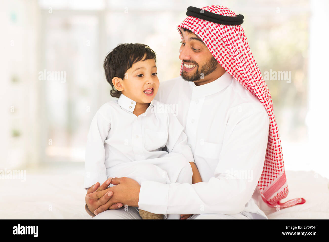 lovely Arabic man talking to his son Stock Photo