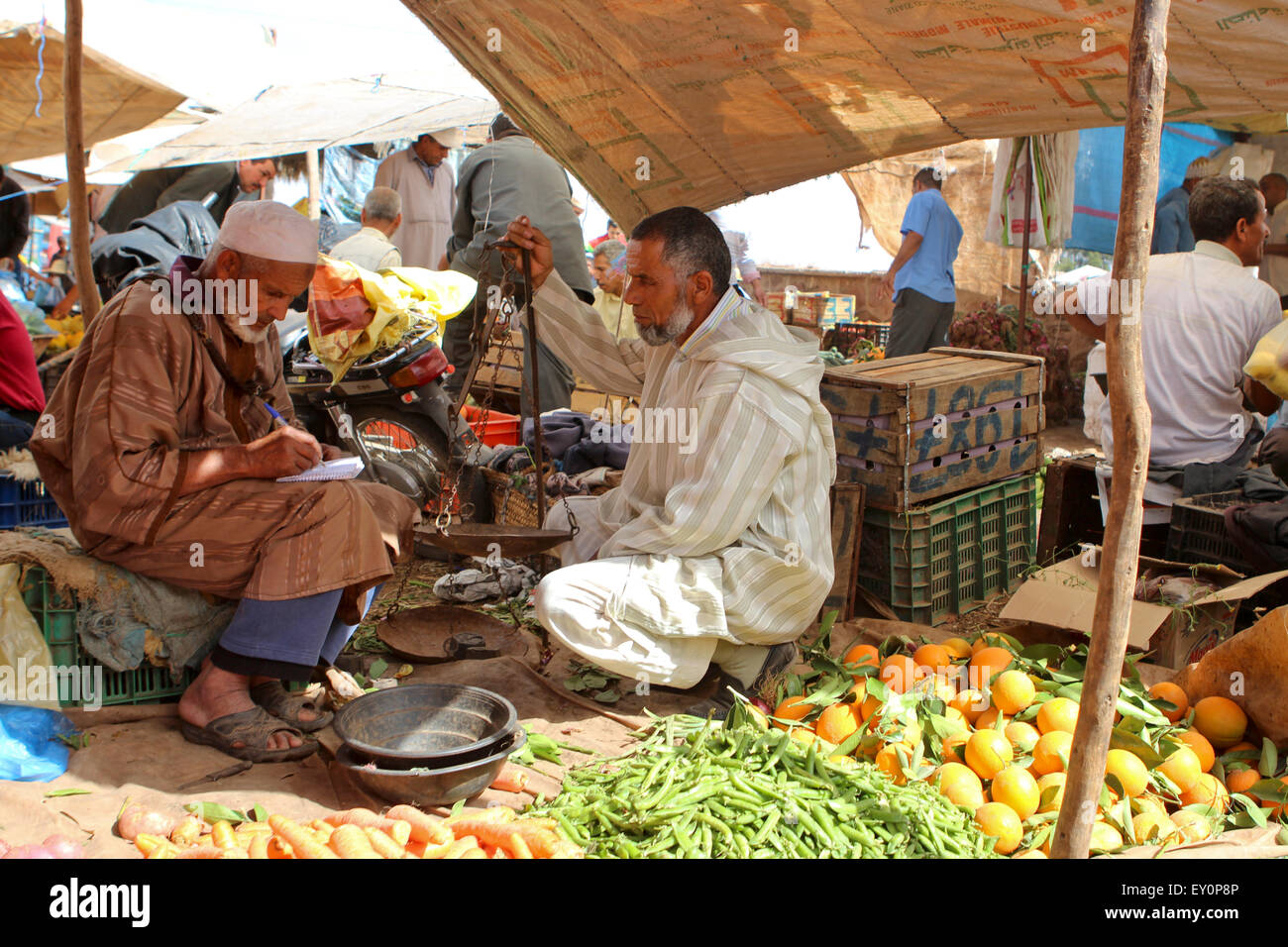 Men trading at a berber village market, near Marrakesh, Morocco Stock Photo