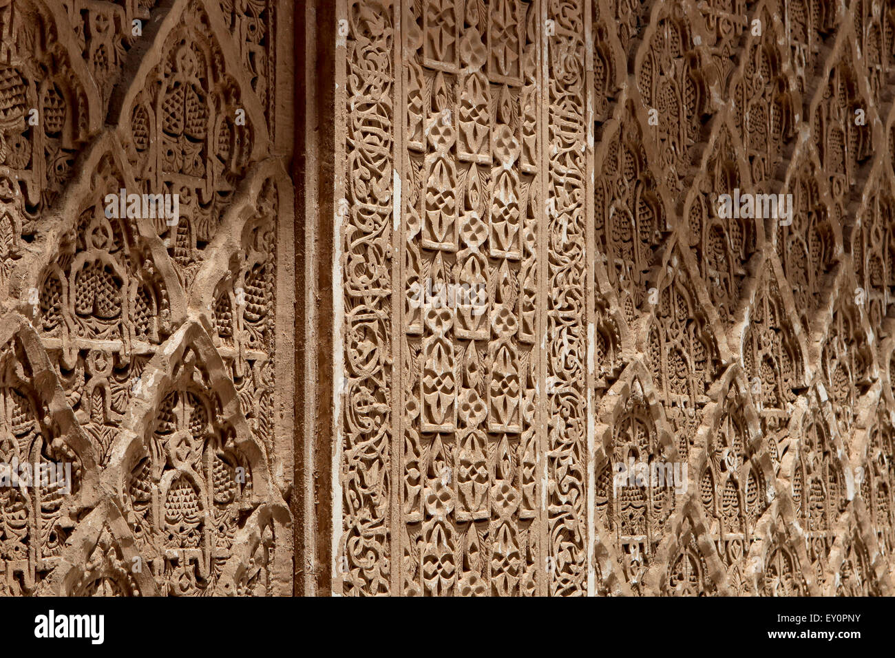 Richly detailed Arabesque stucco wall carving, Ben Youssef Madrasa, Marrakesh, Morocco Stock Photo