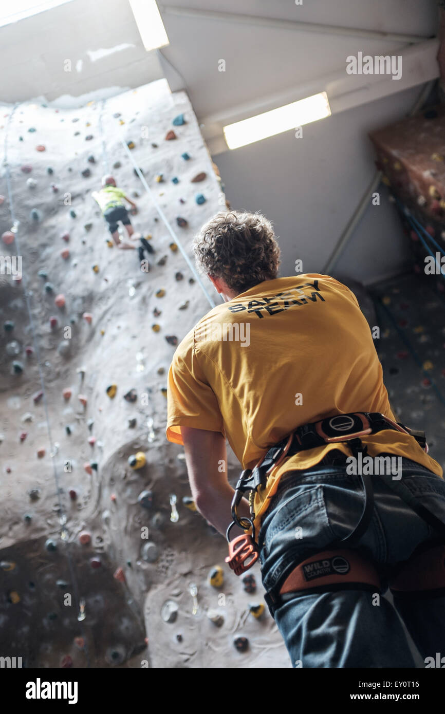 Instructor and climbers at an indoor climbing centre in the UK Stock