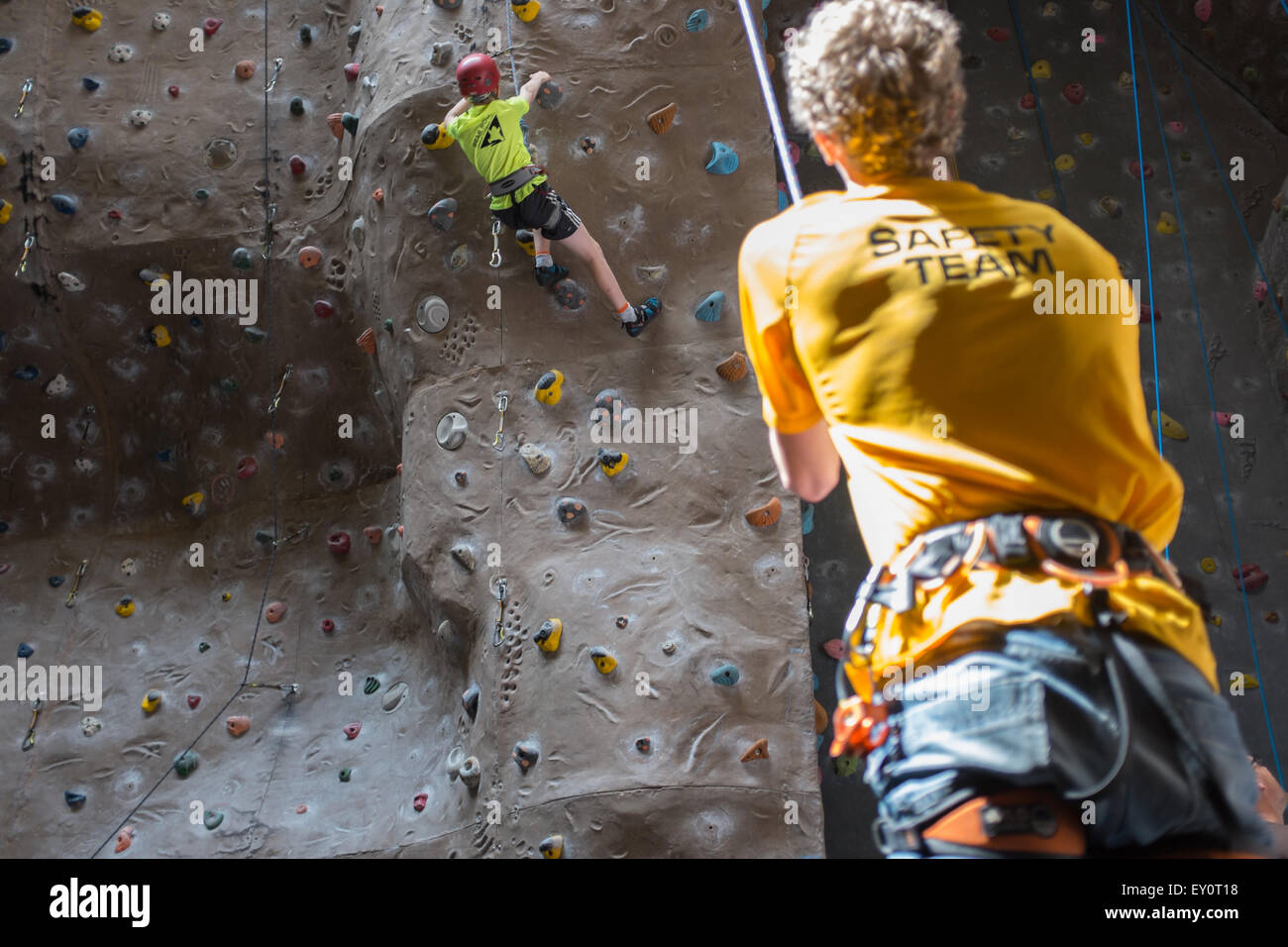 Instructor and climbers at an indoor climbing centre in the UK Stock Photo