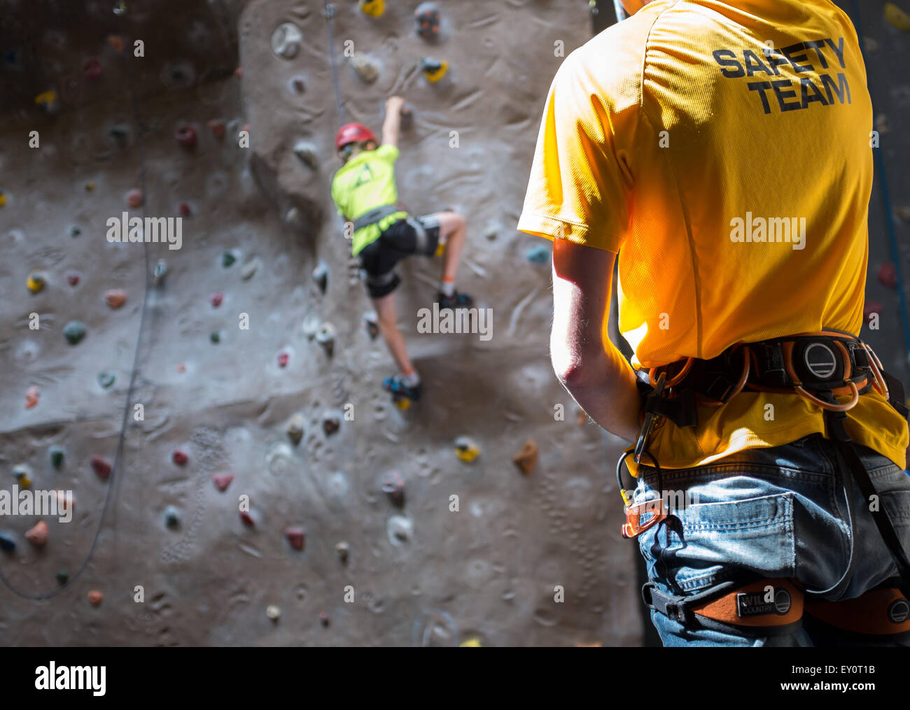 Instructor and climbers at an indoor climbing centre in the UK Stock