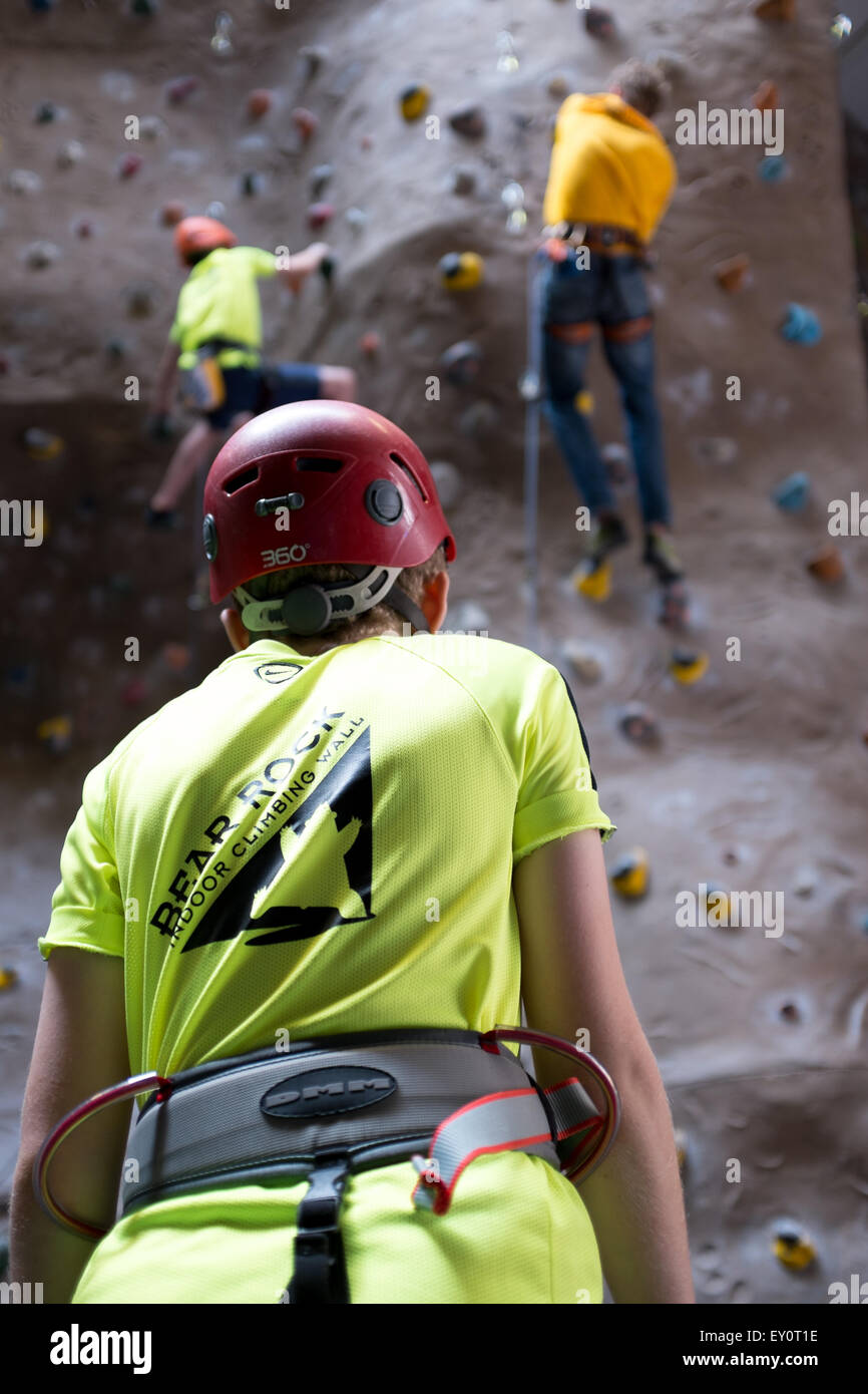 Instructor and climbers at an indoor climbing centre in the UK Stock