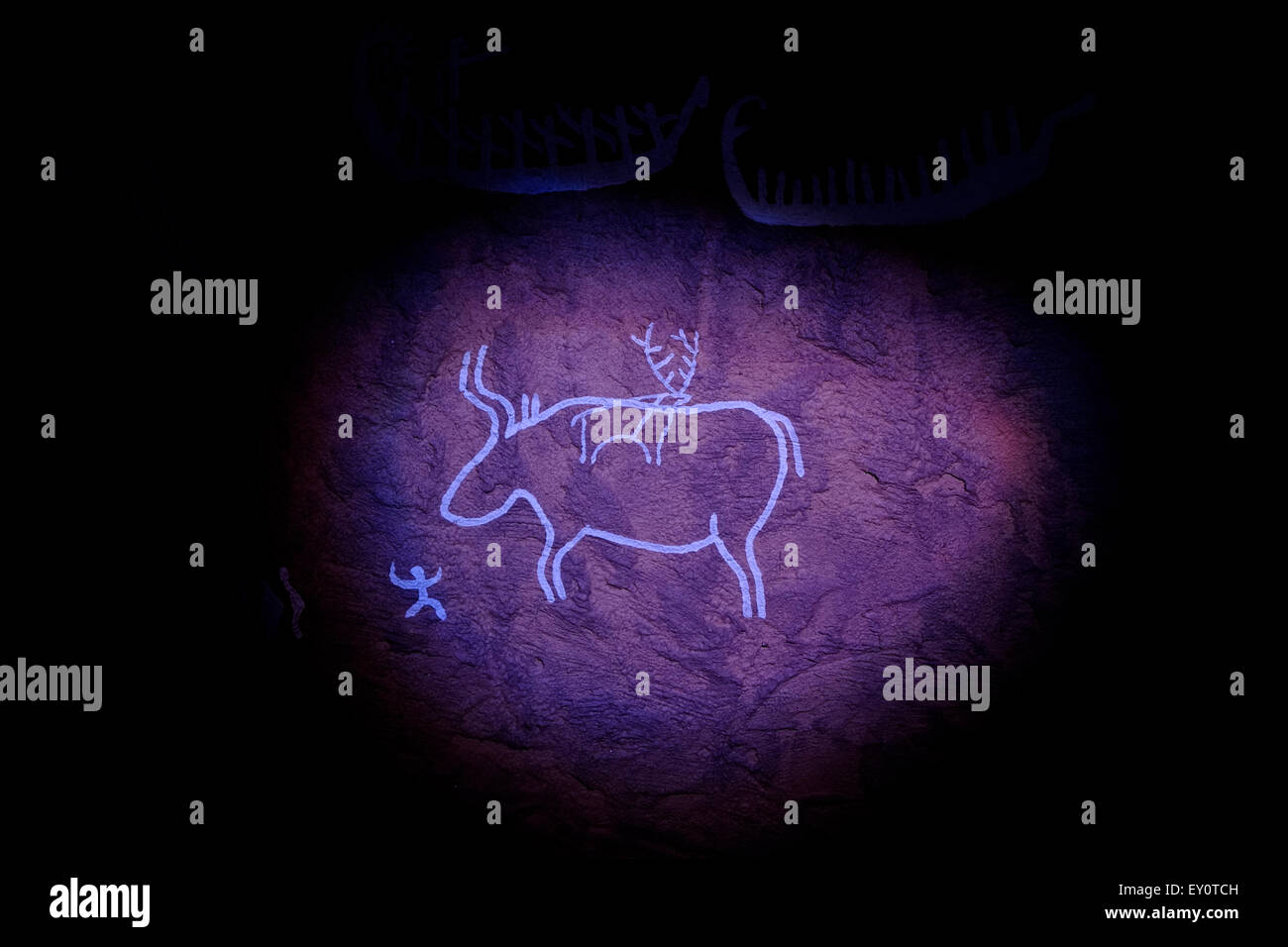 An illuminated illustration depicting ancient petroglyph displayed at the museum of Gobustan National Park located west of the settlement of Gobustan on the Caspian Sea Azerbaijan Stock Photo